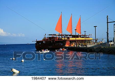 Hawaii, Big Island, Kailua-Kona, Sunset Cruise Boat Loads Passengers At Dock, Three Bright Orange Sails. View Large Photo Image Stock Photo - Hawaii, Big Island, Kailua-Kona, Sunset Cruise Boat Loads Passengers At Dock, Three Bright Orange Sails.. Fotosearch
