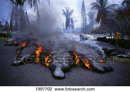 Stock Image - Hawaii, Big Island, Kilauea Volcano, Kalapana Active Lava Flow Over Road A28F. Fotosearch