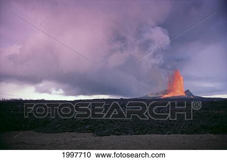 Stock Image - Hawaii, Big Island, Kilauea Volcano Eruption, Fountaining Lava At Dusk In Distance A26B. Fotosearch