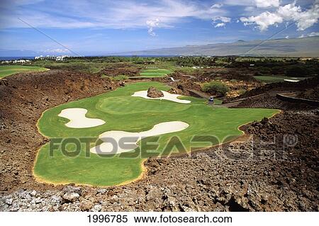 Stock Photography - Hawaii, Big Island, Kohala, Mauna Lani Resort, Francis I'i Brown, North Golf Course, Sand Traps, Lava Surrounding Green. Fotosearch