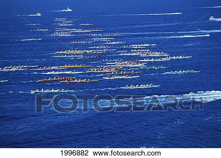 Stock Image - Hawaii, Big Island, Kona, Aerial Side View Of Queen Liliuokalani Canoe Race, Colorful. Fotosearch