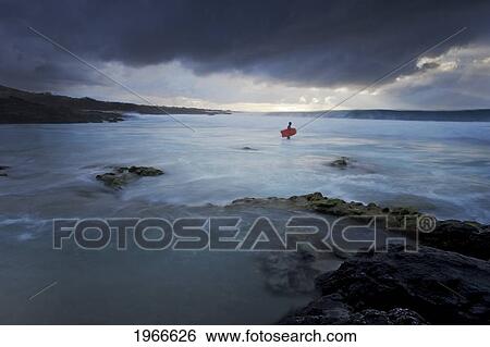 Hawaii, Big Island, Kona Coast, Kua Bay, Bodyboarder Checking Out Stormy Surf, Long Exposure - Showing Motion. View Large Photo Image Stock Photograph - Hawaii, Big Island, Kona Coast, Kua Bay, Bodyboarder Checking Out Stormy Surf, Long Exposure - Showing Motion.. Fotosearch