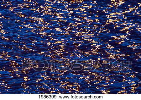 Stock Photo - Hawaii, Big Island, Kona Coast, Wave Patterns Reflecting The Sunset.. Fotosearch