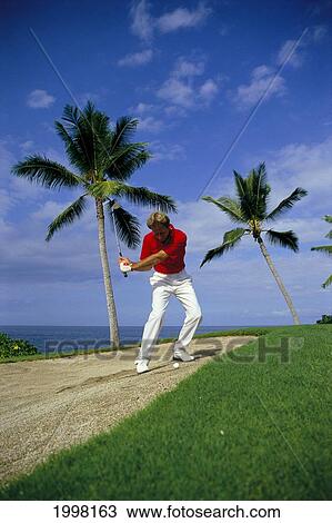 Stock Image - Hawaii, Big Island, Kona Country Club, Golf Pro Ken Springer, Sand Trap, 12Th Hole A19E. Fotosearch