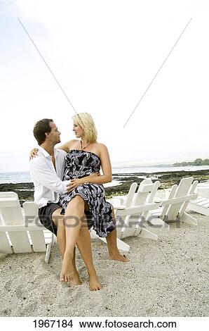 Picture - Hawaii, Big Island, Kona, Couple Lounging On White Beach Chairs.. Fotosearch