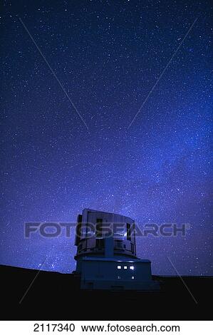 Stock Image - Hawaii, Big Island, Mauna Kea, The Japanese National Large Telescope and a starry sky.. Fotosearch