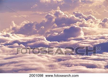 Stock Photo - Hawaii, Big Island, Mauna Kea, View From Above And Through Sky With Layer Of Puffy Clouds Pink Gray. Fotosearch