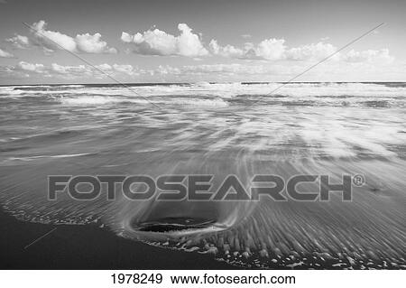 Hawaii, Big Island, North Kohala, Pololu Black Sand Beach, Blur Of Water Patterns (Black And White Photograph). View Large Photo Image Stock Photo - Hawaii, Big Island, North Kohala, Pololu Black Sand Beach, Blur Of Water Patterns (Black And White Photograph).. Fotosearch