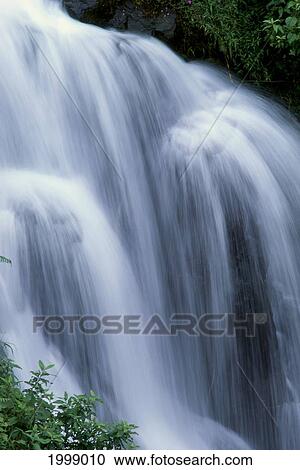 Stock Image - Hawaii, Big Island, One Of Many Waterfalls Along Hamakua Coast, Blur Action B1608. Fotosearch