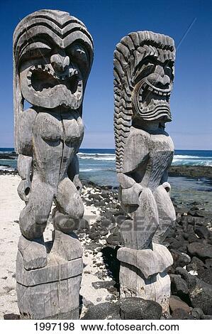 Stock Photo - Hawaii, Big Island, Place Of Refuge, Close-Up Of Tiki God Statues, Ocean A45A. Fotosearch