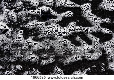 Stock Photography - Hawaii, Big Island, Pololu Black Sand Beach, Sea Foam On Sandy Shore.. Fotosearch