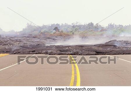 Stock Image - Hawaii, Big Island, Puna, Lava Flow Across Highway 130. Fotosearch