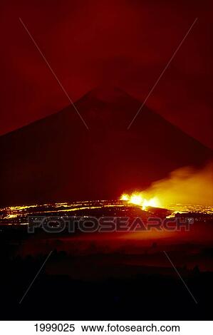 Stock Photography - Hawaii, Big Island, Puu Oo Cinder Cone Silhouetted At Night, Glowing Lava Steaming B1576. Fotosearch