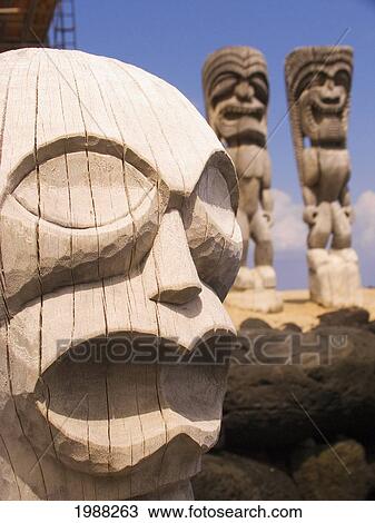Stock Image - Hawaii, Big Island, Puuhonua O Honaunau, City Of Refuge, Close-Up Of Ki'i, Two More Behind.. Fotosearch