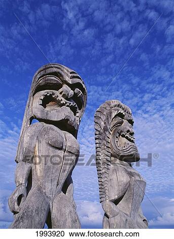 Hawaii, Big Island, Puuhonua O Honaunau, City Of Refuge, Ki'i Against Bright Blue Sky And Clouds. View Large Photo Image Stock Image - Hawaii, Big Island, Puuhonua O Honaunau, City Of Refuge, Ki'i Against Bright Blue Sky And Clouds.. Fotosearch