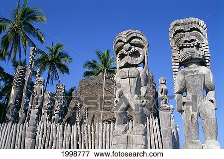 Stock Photo - Hawaii, Big Island, Puuhonua O Honaunau, Tiki Torches, Place Of Refuge, Heiau. Fotosearch