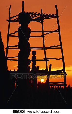 Hawaii, Big Island, Pu'uhonua O Honaunau National Historical Park, Structure And Statues Silhouetted By Fiery Sunset. View Large Photo Image Stock Photograph - Hawaii, Big Island, Pu'uhonua O Honaunau National Historical Park, Structure And Statues Silhouetted By Fiery Sunset.. Fotosearch