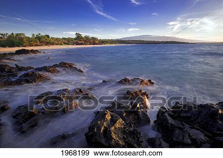 Hawaii, Big Island, South Kohala, Hapuna Beach, Water Washing Onto Rocks, Cloudy Sky. View Large Photo Image Stock Photo - Hawaii, Big Island, South Kohala, Hapuna Beach, Water Washing Onto Rocks, Cloudy Sky.. Fotosearch