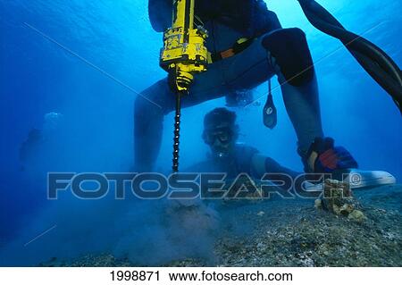 Stock Image - Hawaii, Big Island, Underwater Drilling. Fotosearch