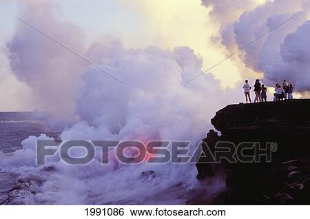Stock Photograph - Hawaii, Big Island, Wahaula, People Watching Lava Flow Into Ocean. Fotosearch