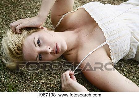 Hawaii, Big Island, Woman Lying On Ground. View Large Photo Image Stock Photo - Hawaii, Big Island, Woman Lying On Ground.. Fotosearch