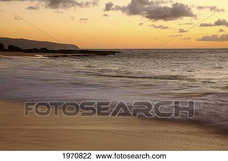 Hawaii, Blur Of Waves Crashing On The Beach At Sunset View Large Photo Image Stock Image - Hawaii, Blur Of Waves Crashing On The Beach At Sunset. Fotosearch