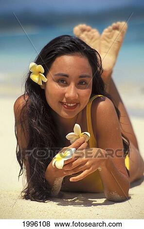 Hawaii, Chinese Woman Posing On Beach With Plumeria Flowers View Large Photo Image Stock Photo - Hawaii, Chinese Woman Posing On Beach With Plumeria Flowers. Fotosearch