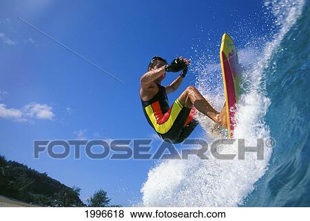 Hawaii, Close-Up Of Man Standing On Bodyboard Towards Camera, Rips Top Of Lip View Large Photo Image Stock Photo - Hawaii, Close-Up Of Man Standing On Bodyboard Towards Camera, Rips Top Of Lip. Fotosearch
