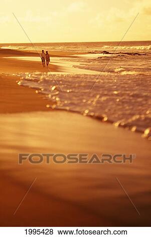 Hawaii, Couple Walking Down The Beach At Sunrise View Large Photo Image Stock Photo - Hawaii, Couple Walking Down The Beach At Sunrise. Fotosearch
