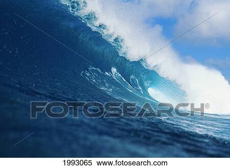 Stock Photography - Hawaii, Curling Wave, White Spray, Blue Sky And Clouds.. Fotosearch