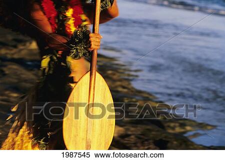 Stock Photography - Hawaii, Detail Of Hands Holding Wooden Paddle, Afternoon Lighting.. Fotosearch