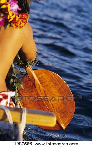 Hawaii, Detail Of Local Woman Paddling Outrigger Canoe With Large Wooden Paddle. No Model Release View Large Photo Image Stock Photograph - Hawaii, Detail Of Local Woman Paddling Outrigger Canoe With Large Wooden Paddle. No Model Release. Fotosearch