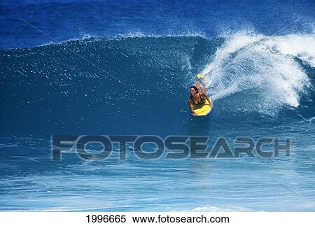 Hawaii, Erin Kamano, Female Body Boarder, Riding Face Of Wave With Spray. View Large Photo Image Stock Photography - Hawaii, Erin Kamano, Female Body Boarder, Riding Face Of Wave With Spray.. Fotosearch