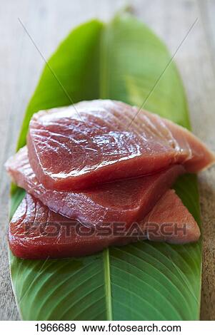 Stock Photo - Hawaii, Fresh Sliced Ahi (Tuna) Fish Sashimi On Banana Leaf.. Fotosearch