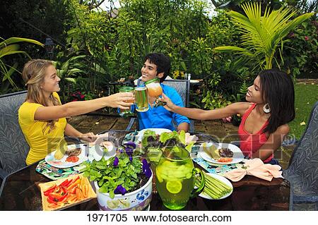 Hawaii, Friends Having Outdoor Barbecue In Tropical Garden. View Large Photo Image Stock Photography - Hawaii, Friends Having Outdoor Barbecue In Tropical Garden.. Fotosearch