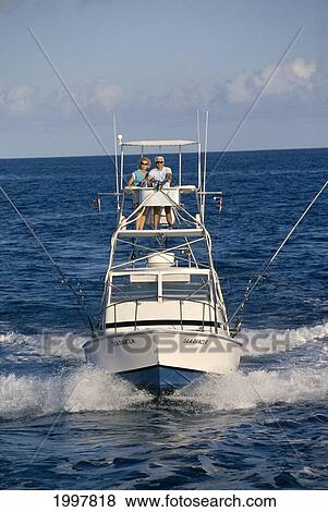 Hawaii, Front View Of Sport Fishing Boat, Senior Couple In Flying Bridge View Large Photo Image Stock Photo - Hawaii, Front View Of Sport Fishing Boat, Senior Couple In Flying Bridge. Fotosearch