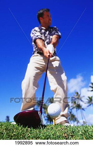 Hawaii, Golfer Sets Up His Shot, View From Below. View Large Photo Image Stock Photography - Hawaii, Golfer Sets Up His Shot, View From Below.. Fotosearch