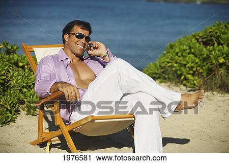 Hawaii, Handsome Man Sitting On Beach With Laptop Computer. View Large Photo Image Stock Image - Hawaii, Handsome Man Sitting On Beach With Laptop Computer.. Fotosearch