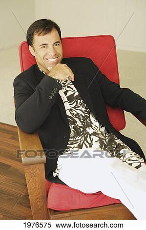 Hawaii, Handsome Man Sitting On Red Lounge Chair. View Large Photo Image Stock Photography - Hawaii, Handsome Man Sitting On Red Lounge Chair.. Fotosearch