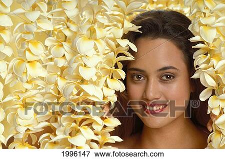 Stock Photo - Hawaii, Hawaiian Beauty Surrounded By Plumeria Leis. Fotosearch