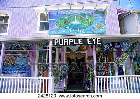 Stock Image - Hawaii, Honomu, Purple Eye Storefront on the Big Island, Merchandise displayed for sale.. Fotosearch