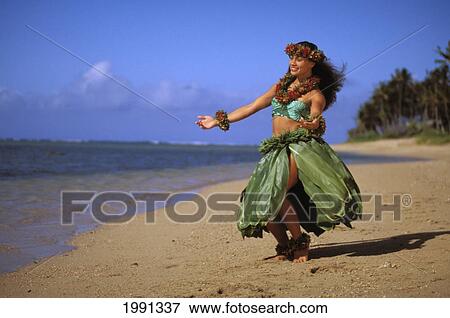 Stock Photo - Hawaii, Hula Girl Dancing On The Beach In A Ti-Leaf Skirt. Fotosearch