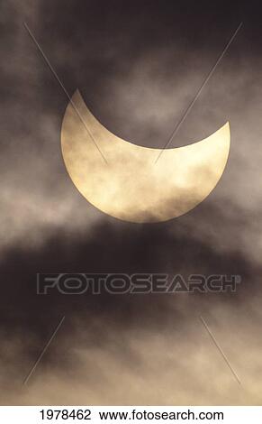 Stock Image - Hawaii, July 11, 1991, Solar Eclipse, Partial With Clouds.. Fotosearch