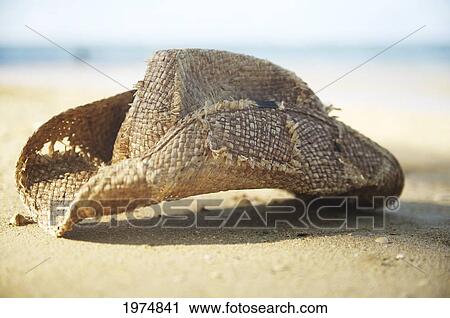 Stock Image - Hawaii, Kauai, Anini Bay, Still Life Of Straw Hat.. Fotosearch