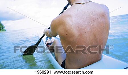 Hawaii, Kauai, Anini Beach, Active Male Paddling In A One Man Canoe. View Large Photo Image Stock Image - Hawaii, Kauai, Anini Beach, Active Male Paddling In A One Man Canoe.. Fotosearch