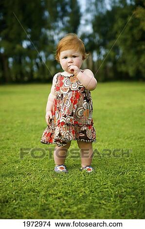 Picture - Hawaii, Kauai, Baby Girl Playing In A Park.. Fotosearch