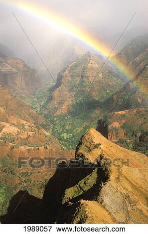 Hawaii, Kauai, Bright Rainbow Over Waimea Canyon. View Large Photo Image Stock Photo - Hawaii, Kauai, Bright Rainbow Over Waimea Canyon.. Fotosearch