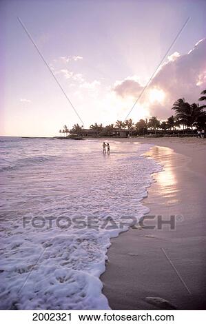 Hawaii, Kauai, Couple Walk Along Poipu Beach At Sunset View Large Photo Image Stock Image - Hawaii, Kauai, Couple Walk Along Poipu Beach At Sunset. Fotosearch