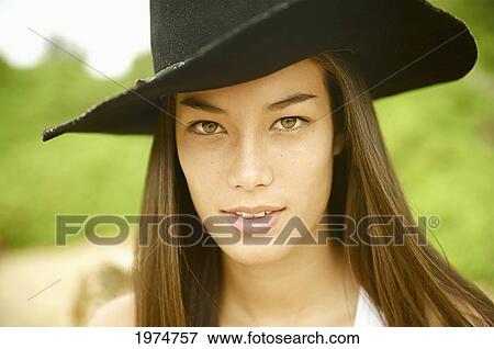 Stock Photo - Hawaii, Kauai, Gillin's Beach, Portrait Of A Cowgirl.. Fotosearch
