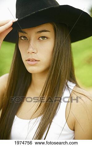 Stock Photograph - Hawaii, Kauai, Gillin's Beach, Portrait Of A Cowgirl.. Fotosearch